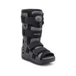 Black Aircast orthopedic walking boot with padded ankle support, adjustable straps, and open toe, shown against a white background; clinical, functional design.