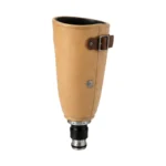 A tan leather prosthetic leg socket with a dark brown buckle strap and metal-and-black lower connector, shown alone on a white background.